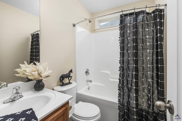 bathroom with toilet, vanity, and shower / tub combo