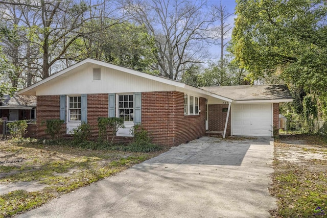 ranch-style home with brick siding, concrete driveway, and an attached garage