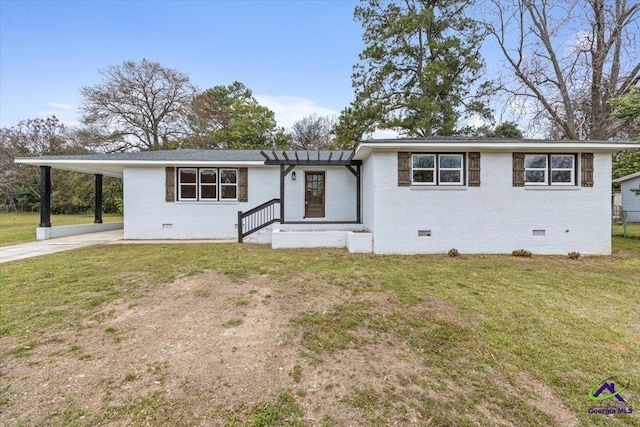 view of front facade featuring an attached carport, brick siding, and crawl space