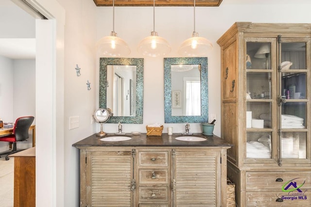 bathroom featuring double vanity and a sink