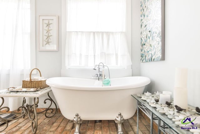 full bathroom featuring a freestanding bath