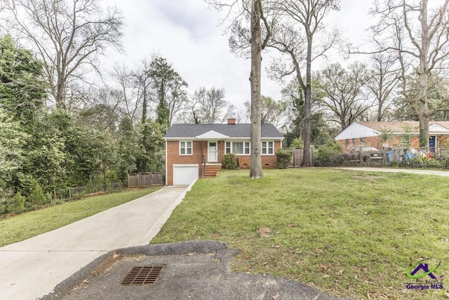 view of front of home with brick siding, fence, a front yard, a garage, and driveway