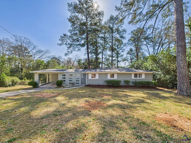 single story home with a carport and a front lawn