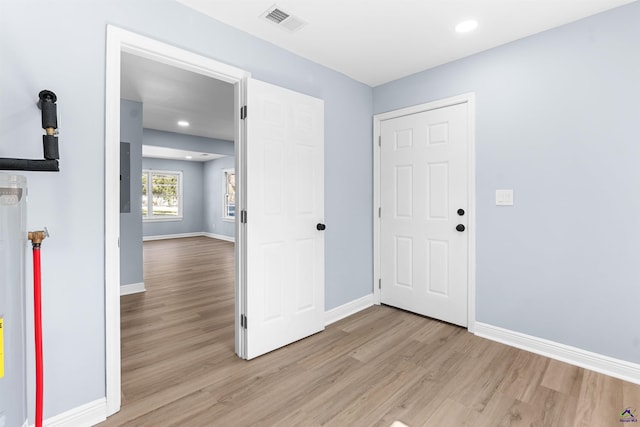 entrance foyer featuring light wood finished floors, visible vents, recessed lighting, and baseboards