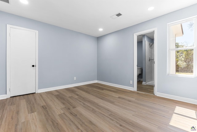 unfurnished room featuring recessed lighting, baseboards, visible vents, and light wood finished floors