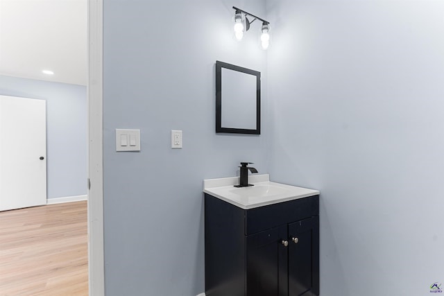 bathroom featuring vanity and wood finished floors