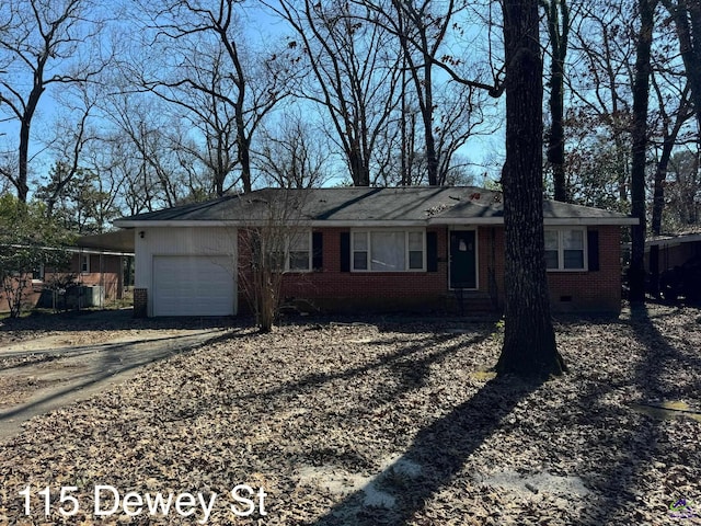 single story home featuring brick siding, crawl space, an attached garage, and driveway