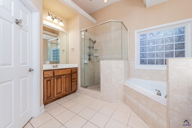 bathroom with tile patterned floors, a stall shower, vanity, and a bath