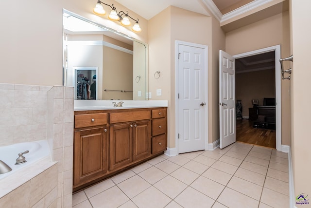 full bathroom featuring tile patterned flooring, a spacious closet, crown molding, a bath, and vanity