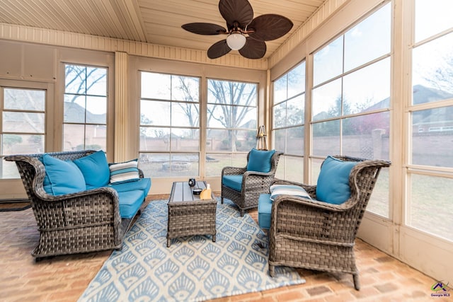 sunroom featuring wooden ceiling and ceiling fan