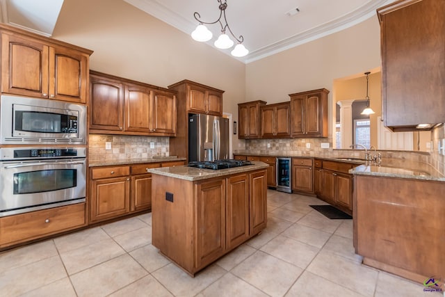 kitchen featuring wine cooler, ornamental molding, brown cabinets, appliances with stainless steel finishes, and a sink