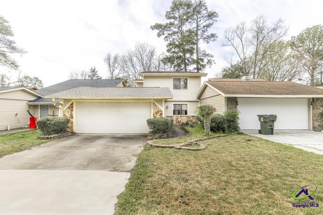 traditional-style home featuring concrete driveway, a garage, stone siding, and a front lawn