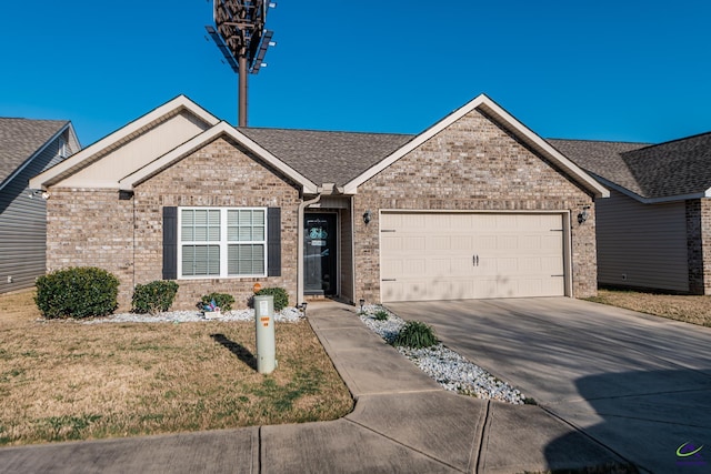 ranch-style house featuring brick siding, a front lawn, roof with shingles, a garage, and driveway