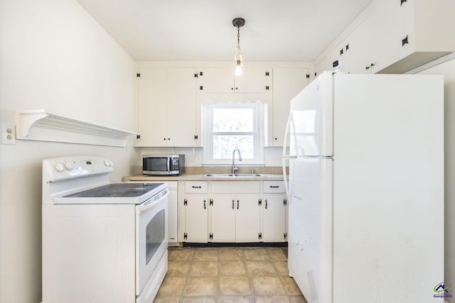 kitchen with a sink, white appliances, white cabinetry, and light countertops