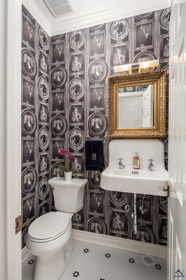 bathroom with tile patterned flooring, toilet, vanity, and visible vents