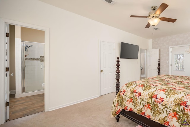 bedroom with visible vents, light colored carpet, wallpapered walls, and baseboards