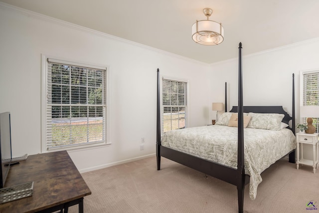 bedroom with light colored carpet, baseboards, and ornamental molding