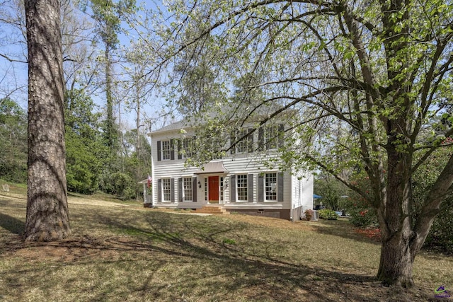 colonial inspired home featuring a front yard and crawl space