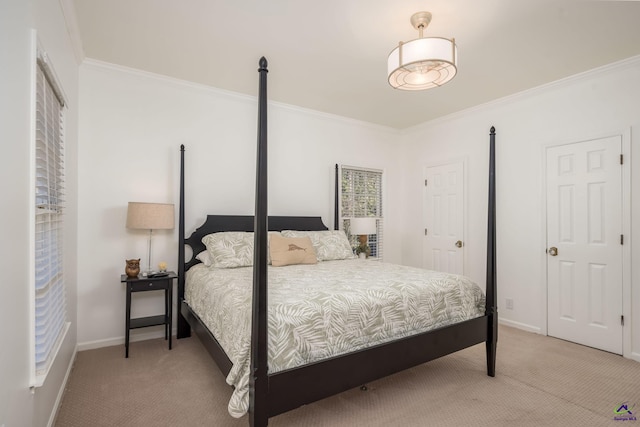 carpeted bedroom featuring baseboards and crown molding