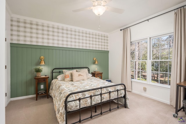 carpeted bedroom featuring multiple windows, wallpapered walls, and ornamental molding