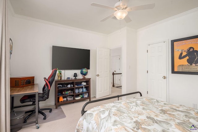 bedroom featuring ceiling fan, carpet, and ornamental molding