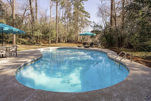 outdoor pool featuring a patio