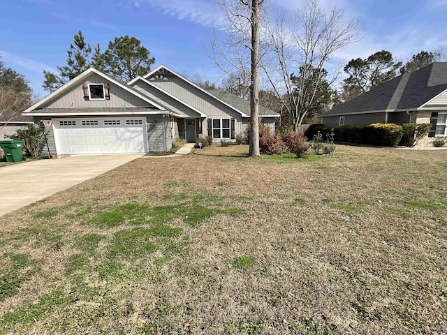 craftsman-style house with an attached garage, concrete driveway, and a front yard