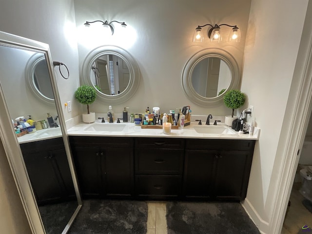 full bath featuring double vanity and a sink