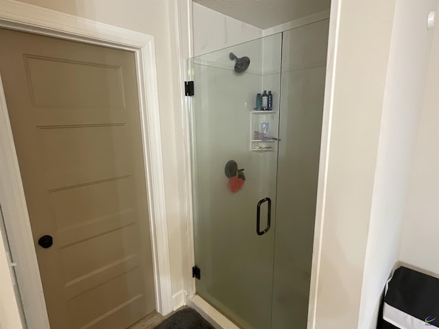 full bath featuring a shower stall