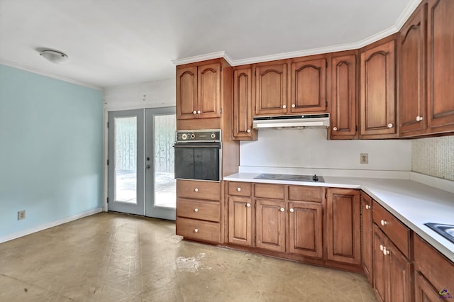 kitchen with black appliances, under cabinet range hood, french doors, brown cabinetry, and light countertops