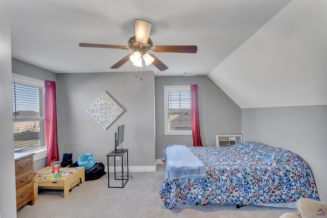 bedroom featuring baseboards, lofted ceiling, a ceiling fan, and carpet flooring