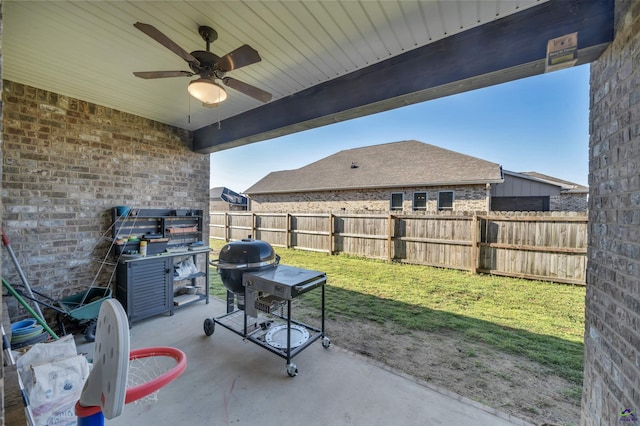 view of patio / terrace with ceiling fan, a grill, and a fenced backyard