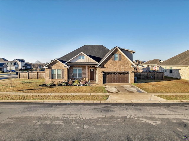 view of front facade with fence, concrete driveway, a front lawn, a garage, and board and batten siding