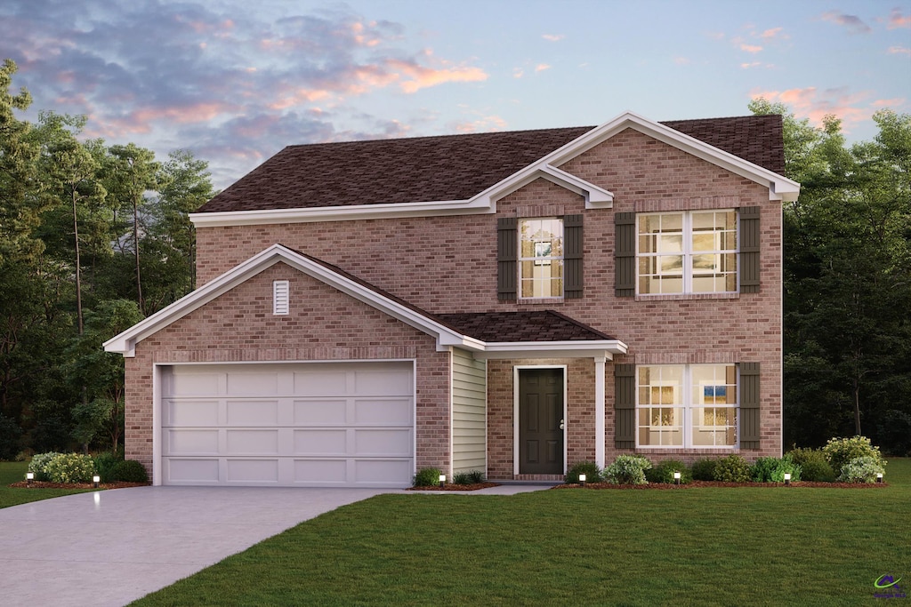 view of front facade featuring a lawn, brick siding, and driveway