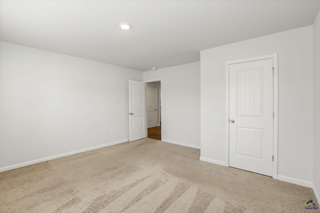 unfurnished bedroom with baseboards and carpet floors