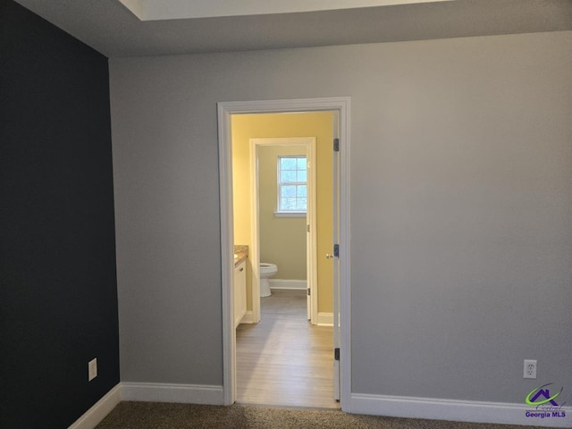 carpeted empty room with baseboards