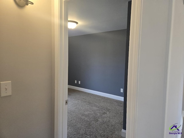 interior space with carpet flooring and baseboards