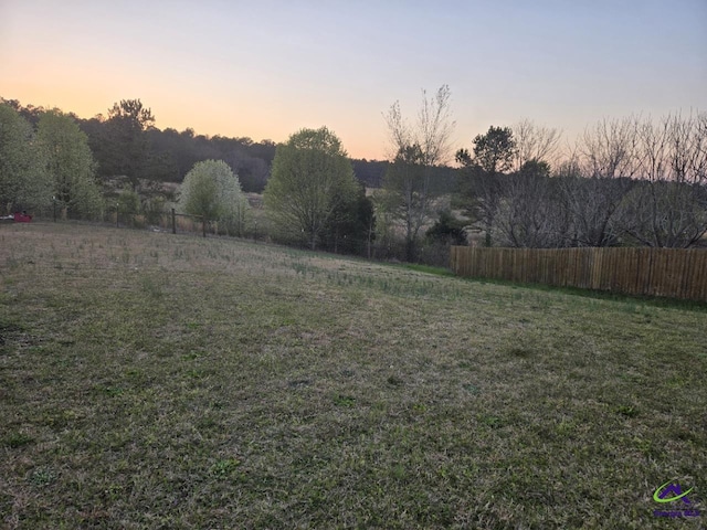 view of yard featuring a rural view and fence