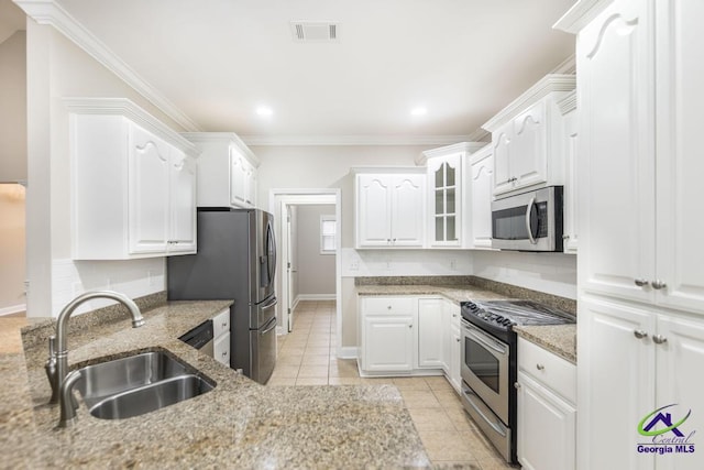 kitchen with visible vents, white cabinets, appliances with stainless steel finishes, and a sink