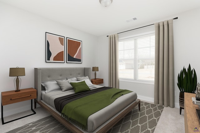 carpeted bedroom featuring visible vents and baseboards