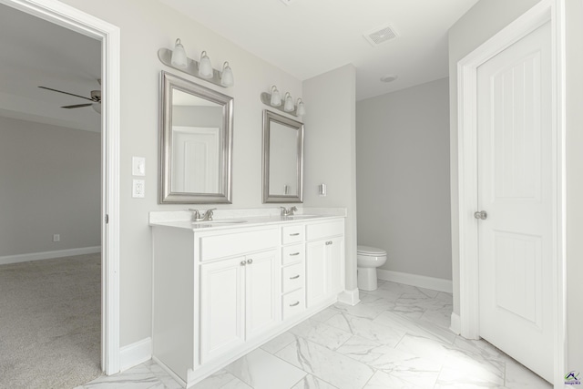 full bathroom featuring visible vents, baseboards, double vanity, marble finish floor, and a sink