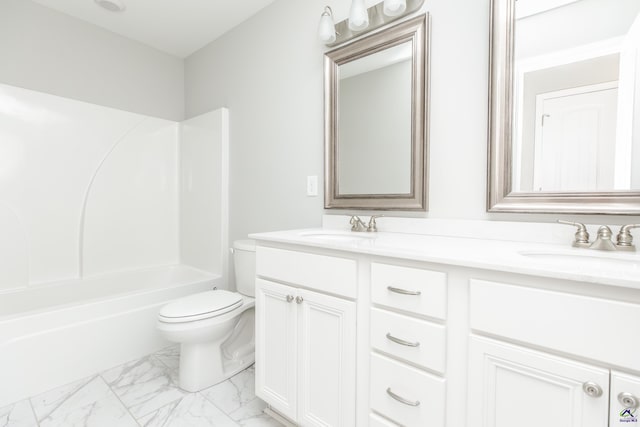 full bath featuring a sink, toilet, marble finish floor, and double vanity