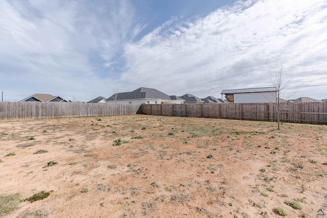 view of yard with a fenced backyard