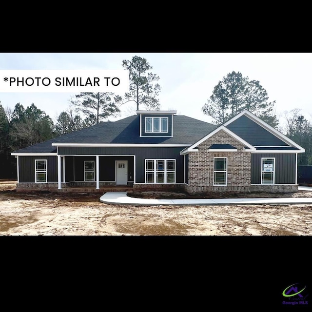 craftsman-style home featuring board and batten siding and covered porch