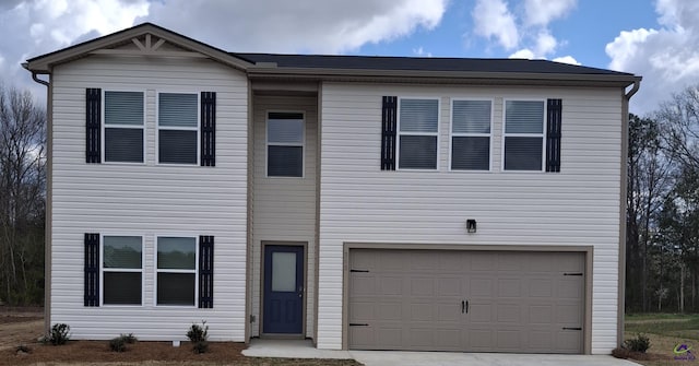 view of front of house featuring driveway and a garage