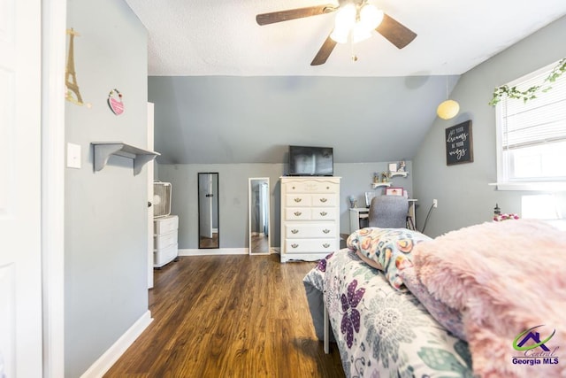 bedroom with vaulted ceiling, wood finished floors, baseboards, and ceiling fan