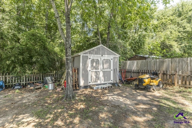 view of shed with a fenced backyard