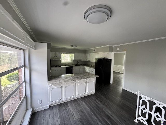 kitchen featuring dark wood-style floors, black appliances, light countertops, and ornamental molding