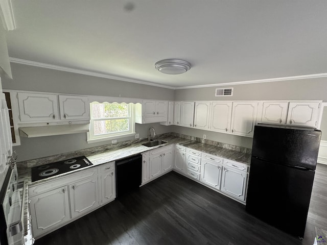 kitchen with visible vents, black appliances, a sink, white cabinets, and crown molding