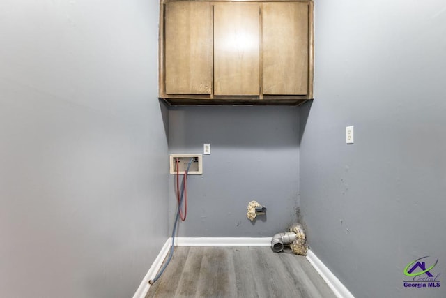 127 Stoneridge Dr, Warner Robins, GA 31088 - washroom with wood finished floors, hookup for a washing machine, cabinet space, and baseboards